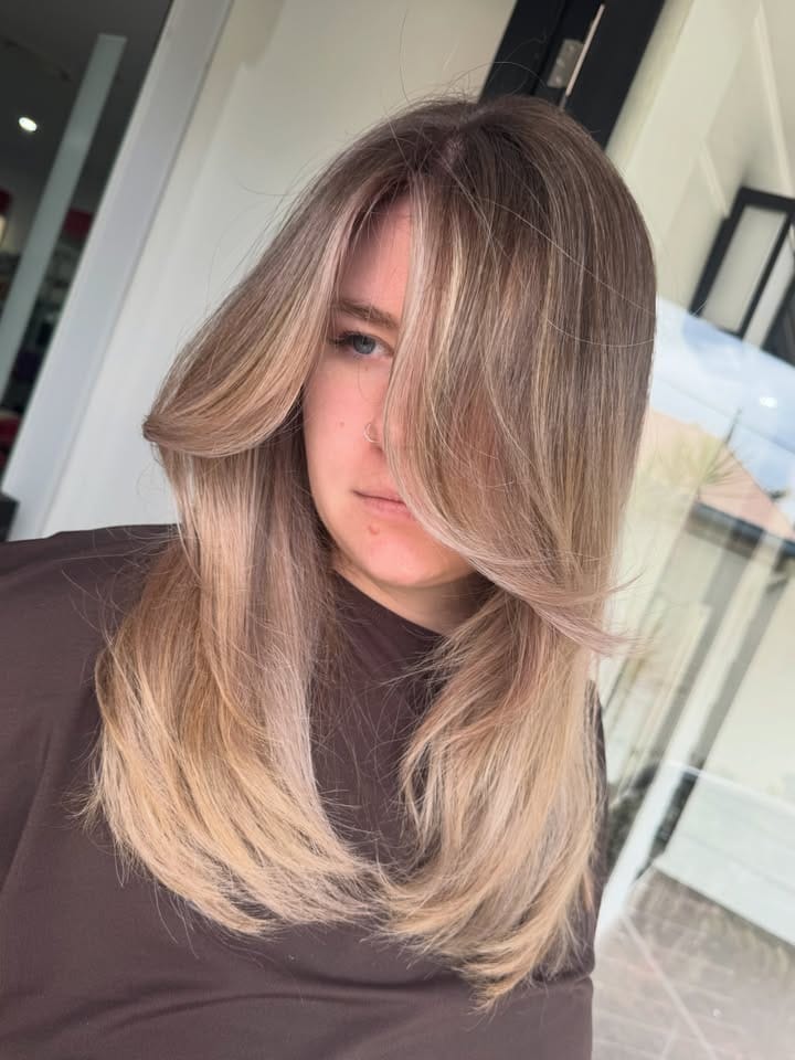 Close detail of the violet undertone in a cool blonde at La Mode Gympie