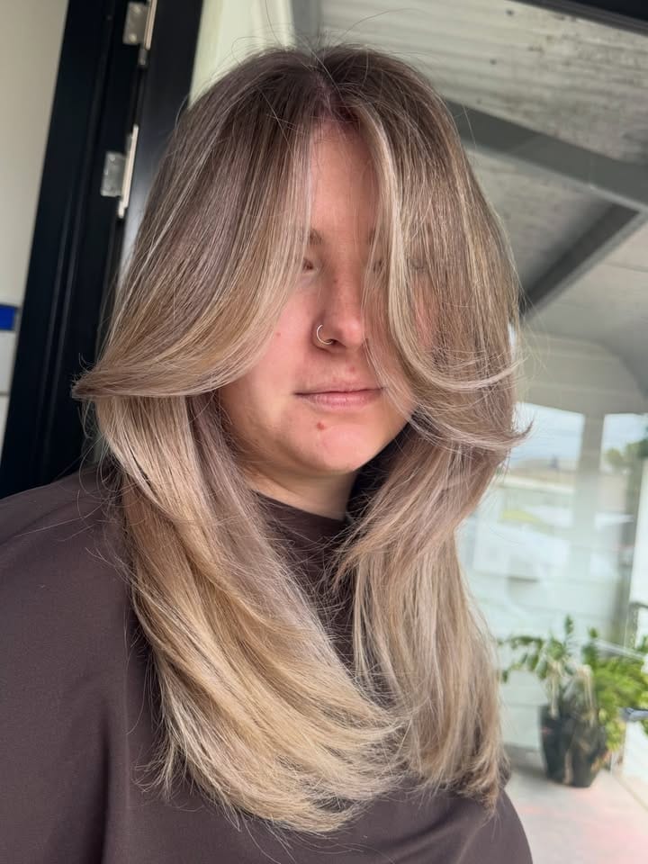 Back view of a smoky blonde with low-maintenance regrowth at La Mode Gympie