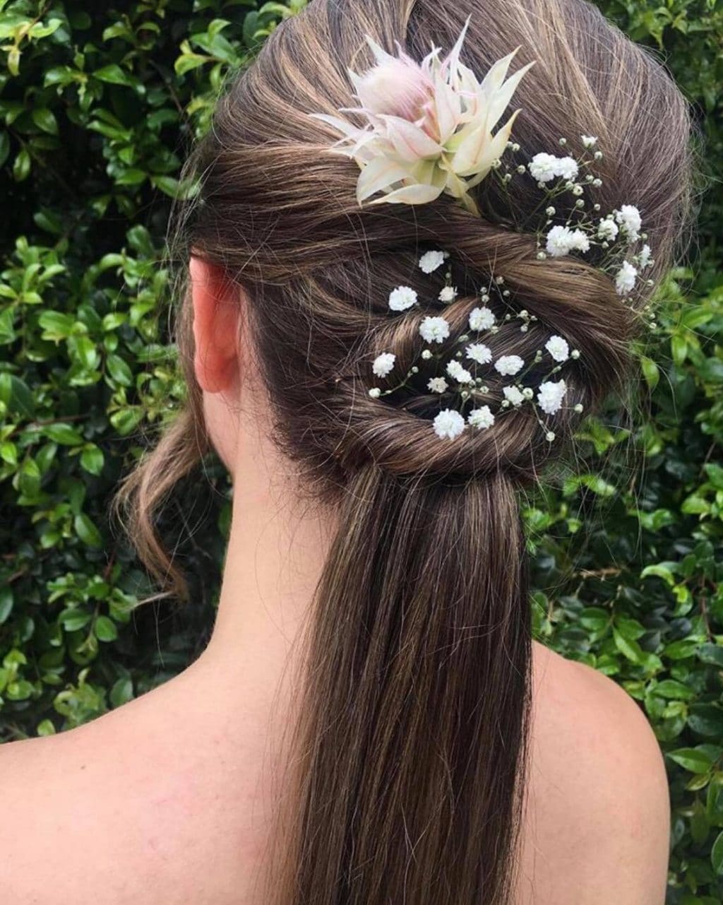 Braided formal updo with fresh flowers by La Mode