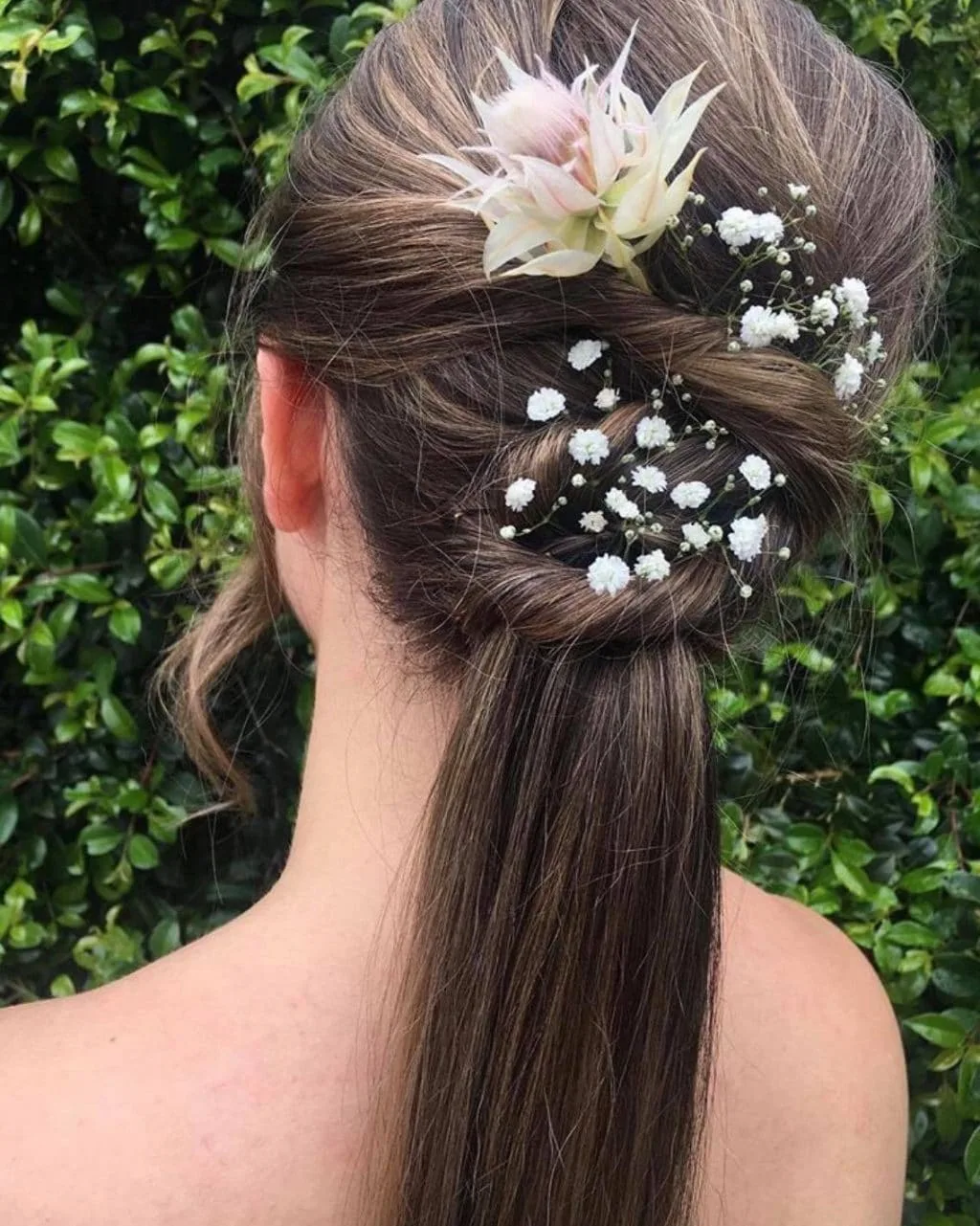 Braided formal updo with fresh flowers by La Mode