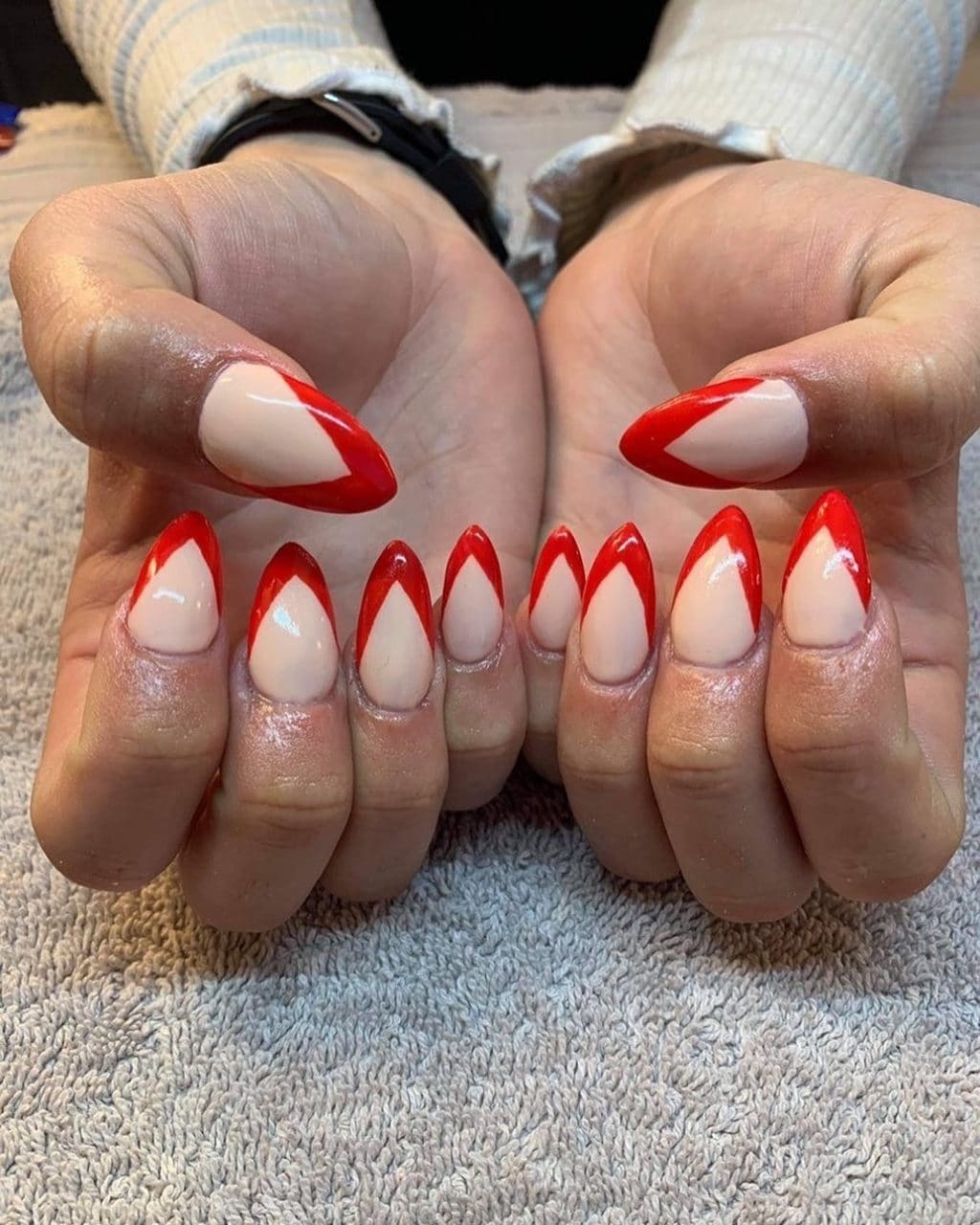 Red French tip stiletto nails by La Mode