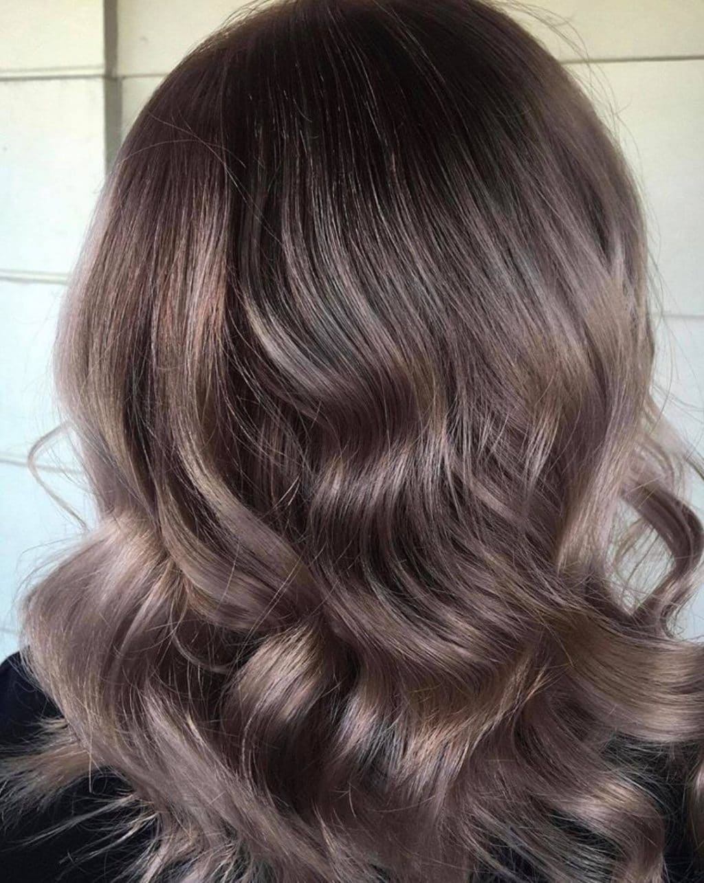 Smoky brunette waves styled at La Mode