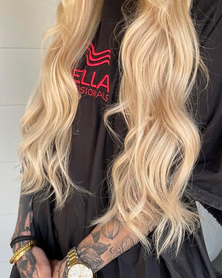 Back view of long blonde hair showing soft blended colour at La Mode Gympie