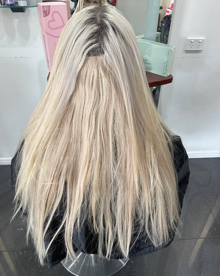 Long blonde hair after a salon finish at La Mode Gympie