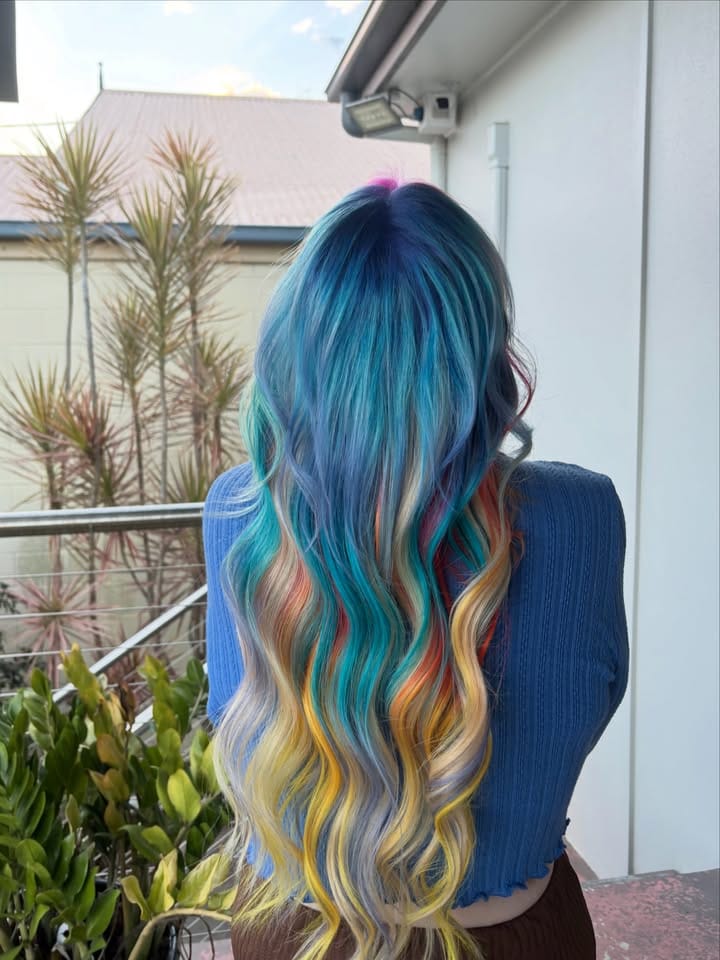Multi-tone rainbow creative colour by Mia at La Mode Gympie, full length back view
