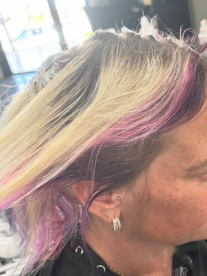 Sectioning detail &mdash; magenta ribbons hand-painted through pre-lightened blonde at La Mode Gympie