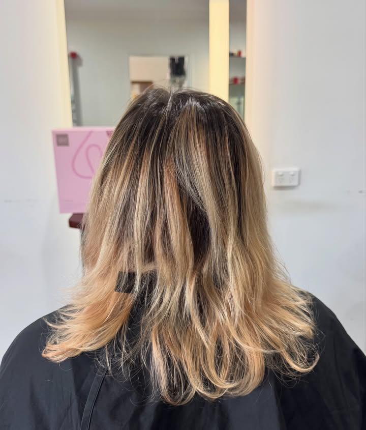 Short rich copper bob with Wella Colour Touch at La Mode Gympie