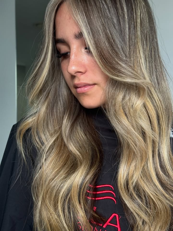 Soft blended Wella blonde with fine woven highlights at La Mode Gympie