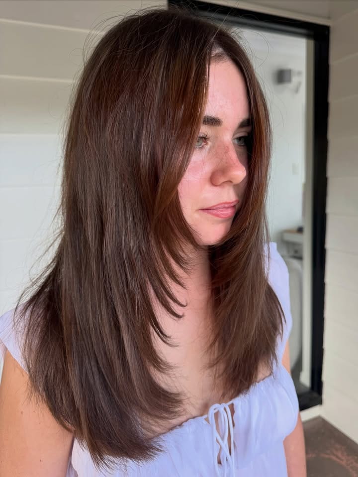 La Mode Hair and Beauty Hair Salon & Beauty Clinic, Gympie QLD New Wella Pure Perfection, now in salon Stylist finishing a blonde blow-dry with a ghd tool at La Mode Gympie